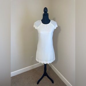 White dress with scalloped hem and sleeves. Size XS.
